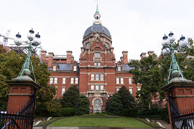 The domed Billings Administration Building at the Johns Hopkins Hospital, seen through the entrance gates